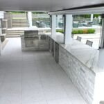 Outdoor porcelain floor tiles in a Michigan backyard patio design