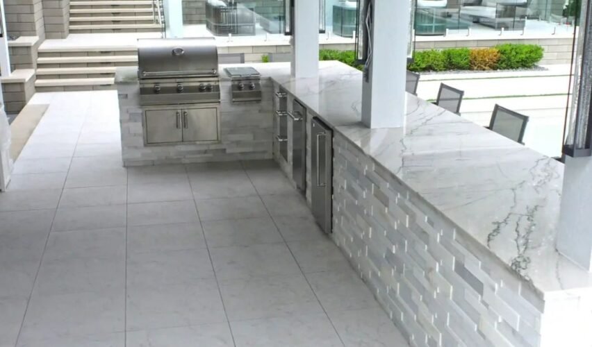 Outdoor porcelain floor tiles in a Michigan backyard patio design